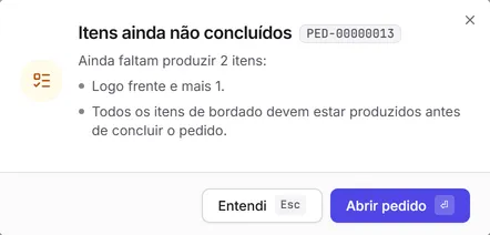 A janela "Itens ainda não concluídos", que impede concluir um pedido com bordados por fazer.